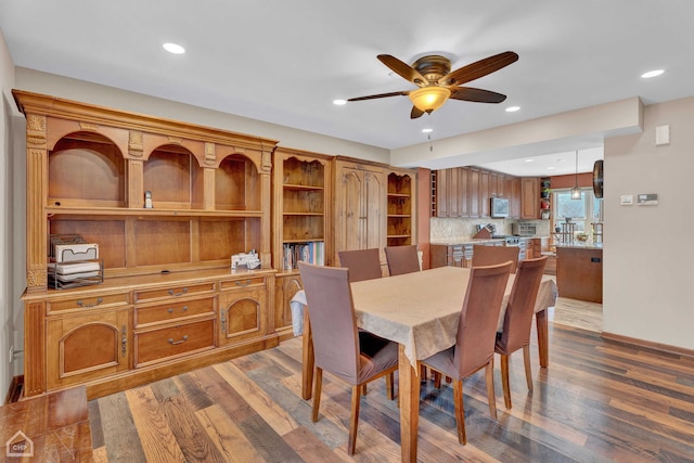 dining space featuring ceiling fan and hardwood / wood-style floors