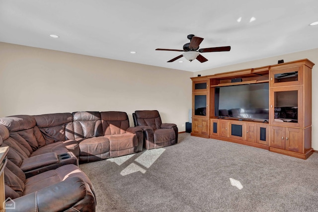 living room with carpet floors and ceiling fan