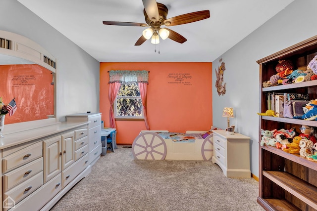 bedroom with light carpet and ceiling fan