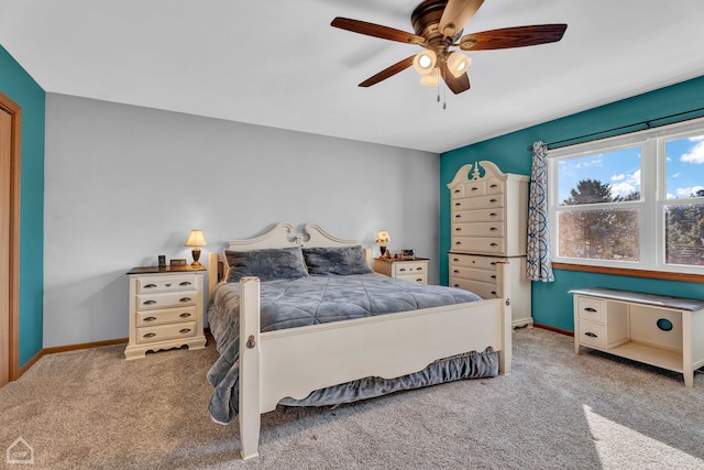 bedroom featuring light colored carpet and ceiling fan