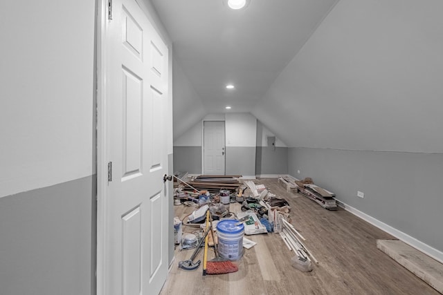 bonus room with lofted ceiling and hardwood / wood-style flooring