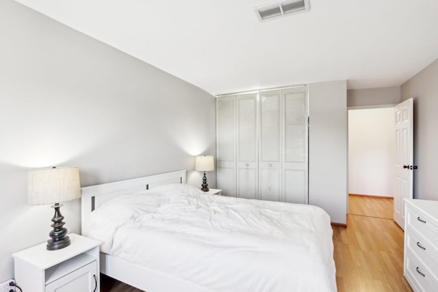 bedroom with light hardwood / wood-style floors