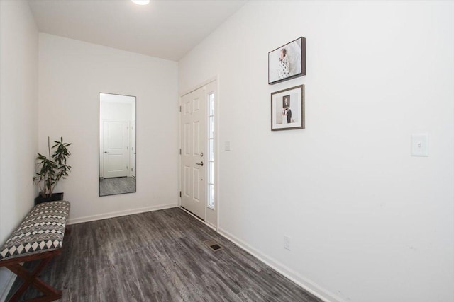 corridor featuring dark hardwood / wood-style floors