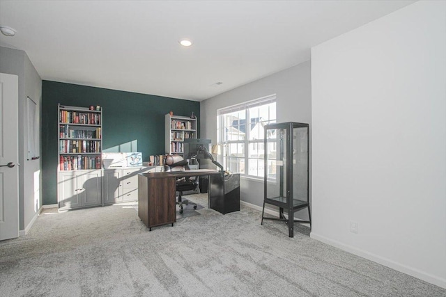 office area featuring light colored carpet