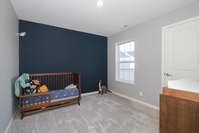 bedroom with light colored carpet