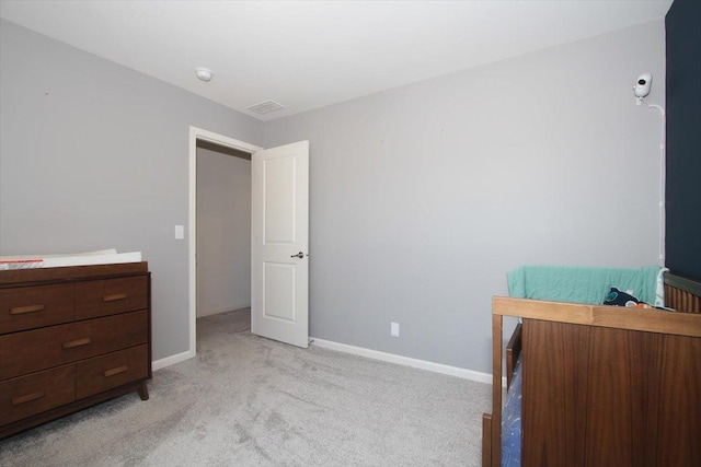 bedroom with light colored carpet