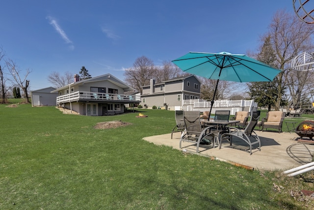 view of yard featuring a patio area and an outdoor fire pit