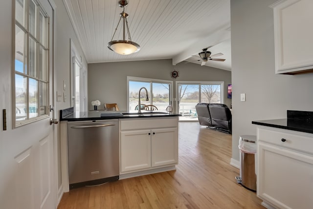 kitchen featuring dishwasher, sink, white cabinets, hanging light fixtures, and light hardwood / wood-style flooring