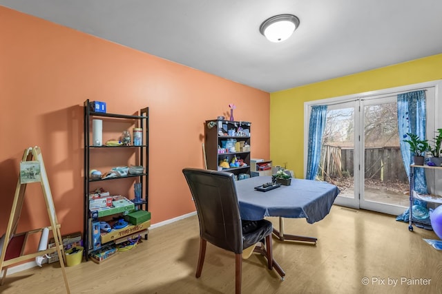 dining space with light wood-type flooring