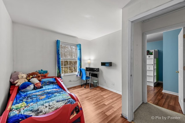 bedroom featuring wood-type flooring