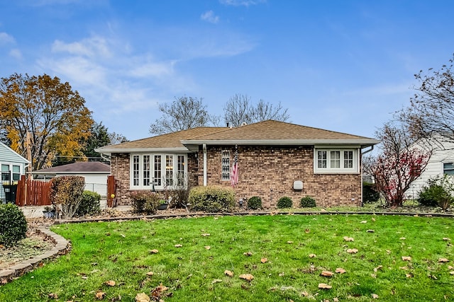 back of house featuring a yard