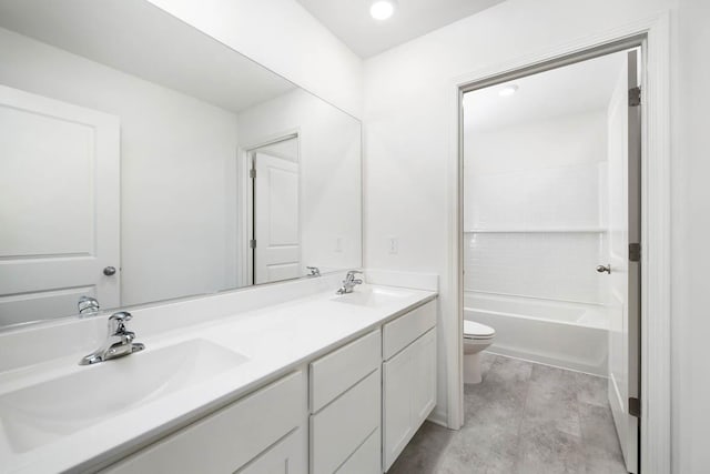 full bathroom featuring toilet, vanity, and  shower combination