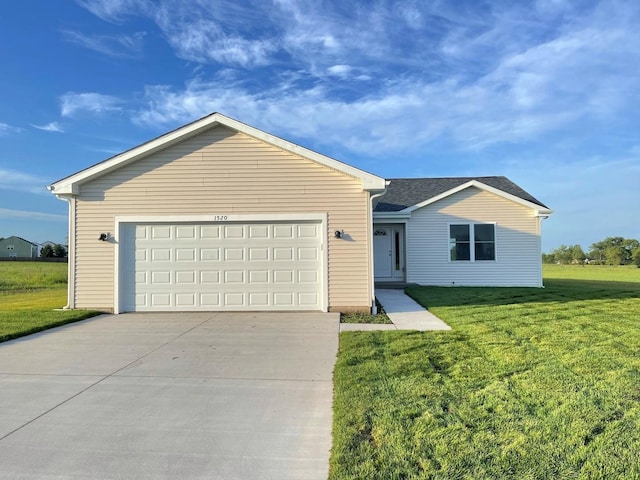 single story home featuring a garage and a front lawn