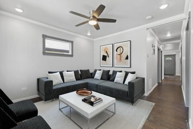 living room with ceiling fan, ornamental molding, and wood-type flooring