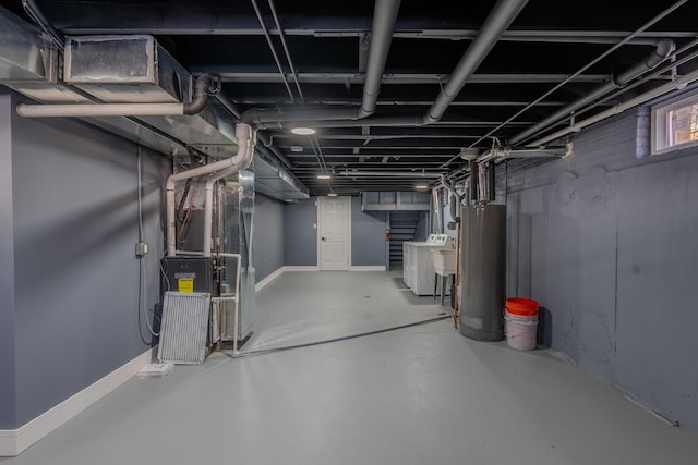 basement featuring water heater, sink, and heating unit