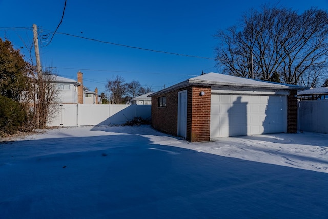 view of snow covered garage