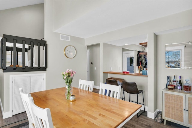 dining space featuring dark hardwood / wood-style floors