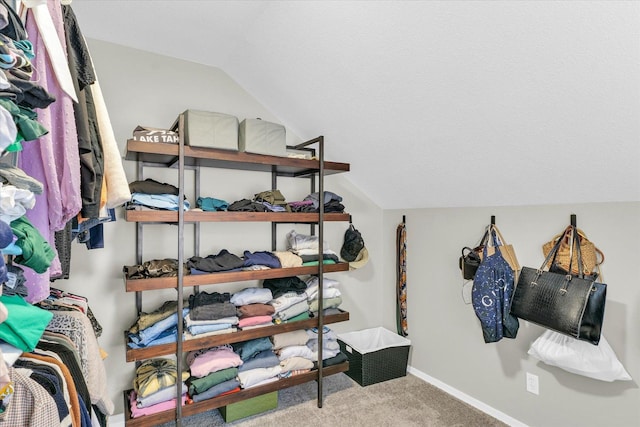 spacious closet with carpet and lofted ceiling