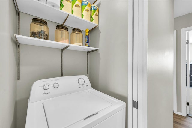 laundry area featuring washer / dryer and hardwood / wood-style flooring