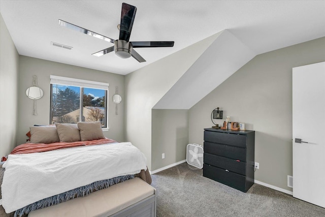 carpeted bedroom with ceiling fan and vaulted ceiling