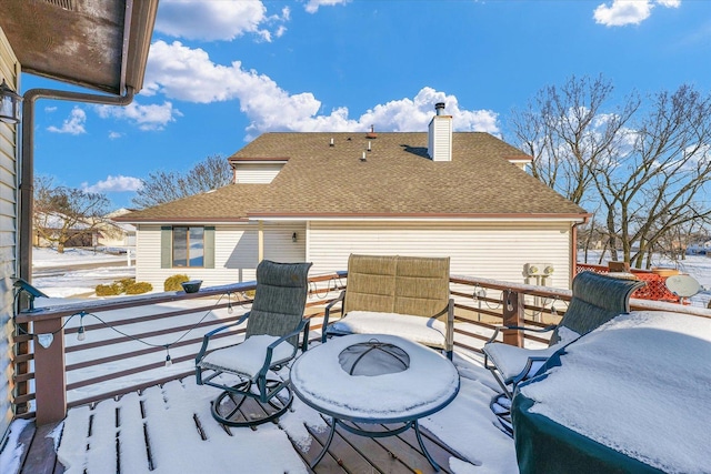 view of snow covered deck