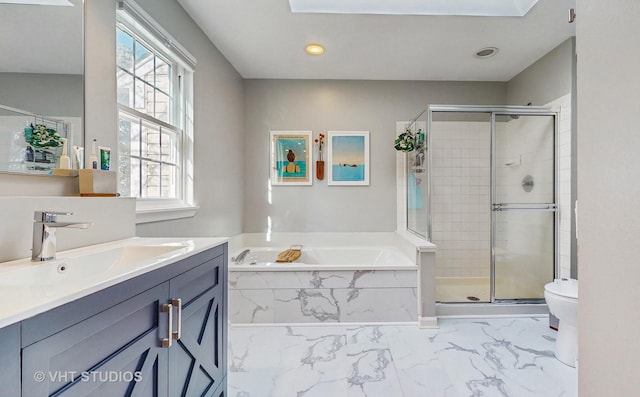 full bathroom featuring toilet, separate shower and tub, and vanity