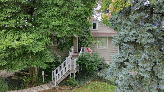 view of property hidden behind natural elements