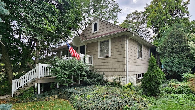 view of side of property featuring a deck