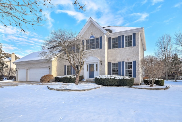 colonial-style house featuring a garage