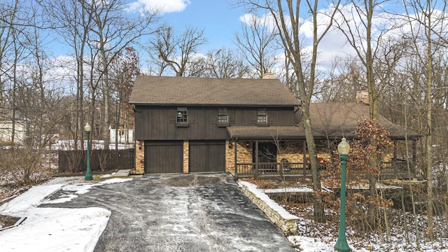 view of front facade with a porch and a garage