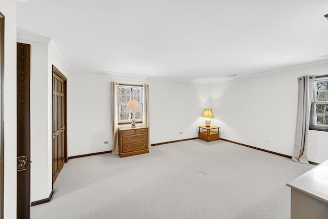 carpeted spare room featuring ornamental molding