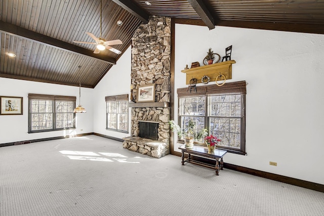 living room featuring a stone fireplace, high vaulted ceiling, ceiling fan, and carpet