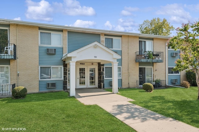 multi unit property featuring french doors and a front lawn