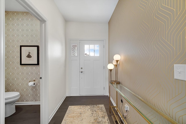 entryway with dark hardwood / wood-style floors