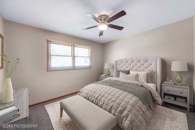 bedroom with ceiling fan and dark carpet