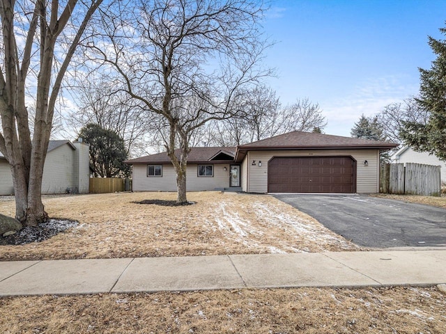 single story home featuring a garage