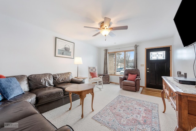 living room with light carpet and ceiling fan