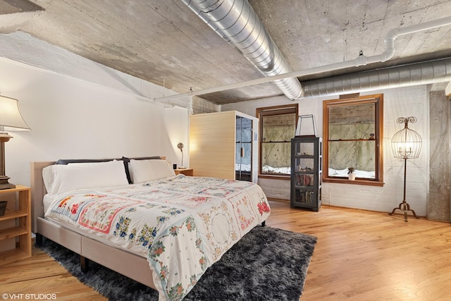 bedroom featuring wood finished floors