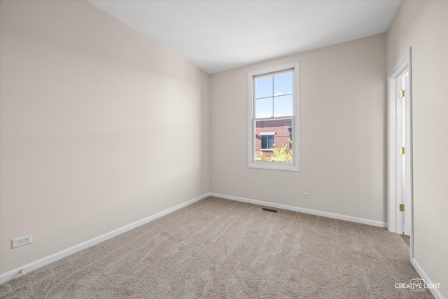 view of carpeted spare room