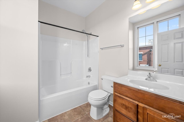 full bathroom with toilet, vanity, tile patterned floors, and washtub / shower combination