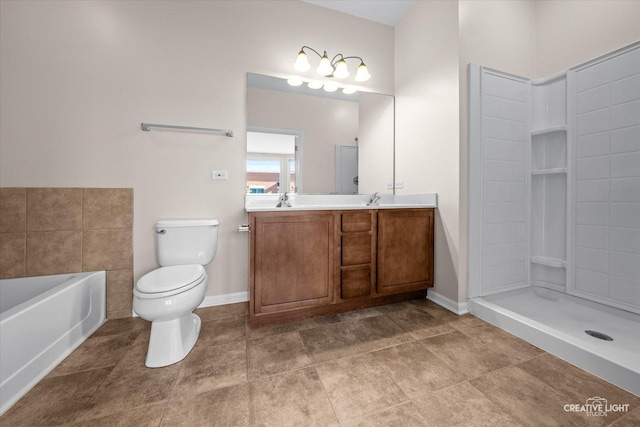 bathroom with toilet, vanity, and a tub to relax in