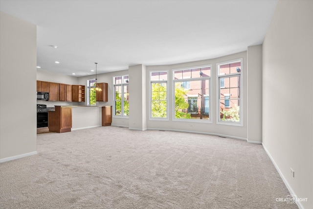 unfurnished living room featuring light colored carpet