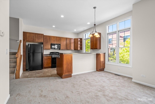 kitchen featuring light colored carpet, black appliances, and pendant lighting