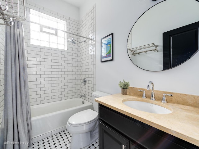 full bathroom featuring vanity, shower / tub combo with curtain, and toilet