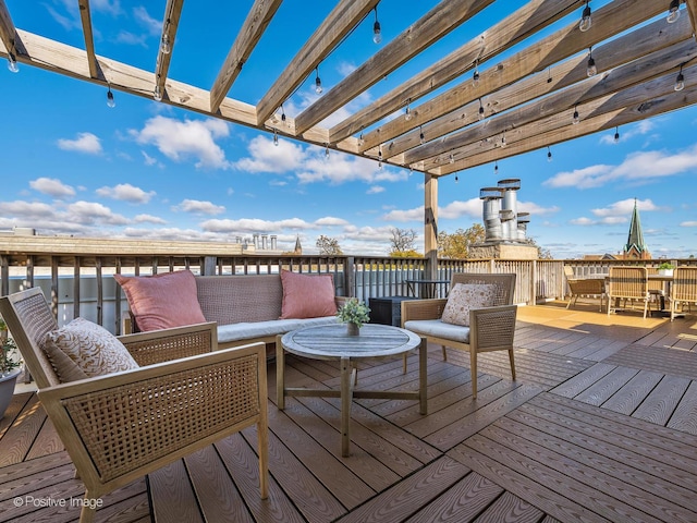 wooden terrace featuring an outdoor hangout area and a pergola