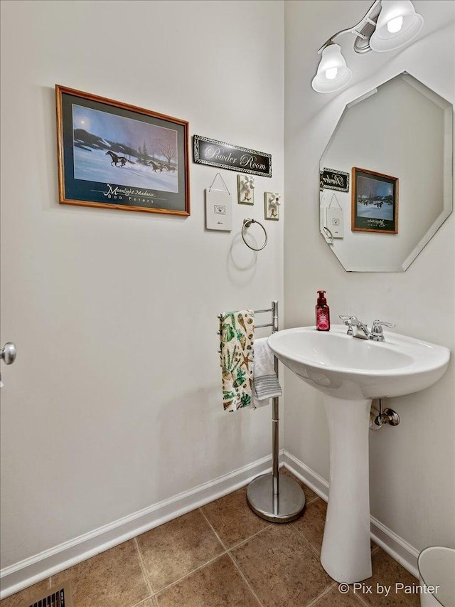 bathroom with tile patterned floors