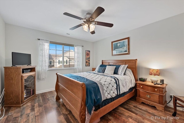 bedroom featuring ceiling fan and dark hardwood / wood-style floors