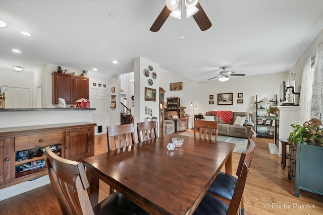 dining area featuring ceiling fan and light wood-type flooring