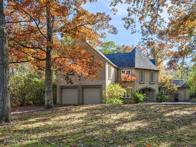 view of front of property with a garage