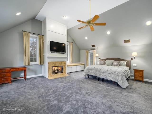 bedroom featuring ceiling fan, lofted ceiling, and dark carpet